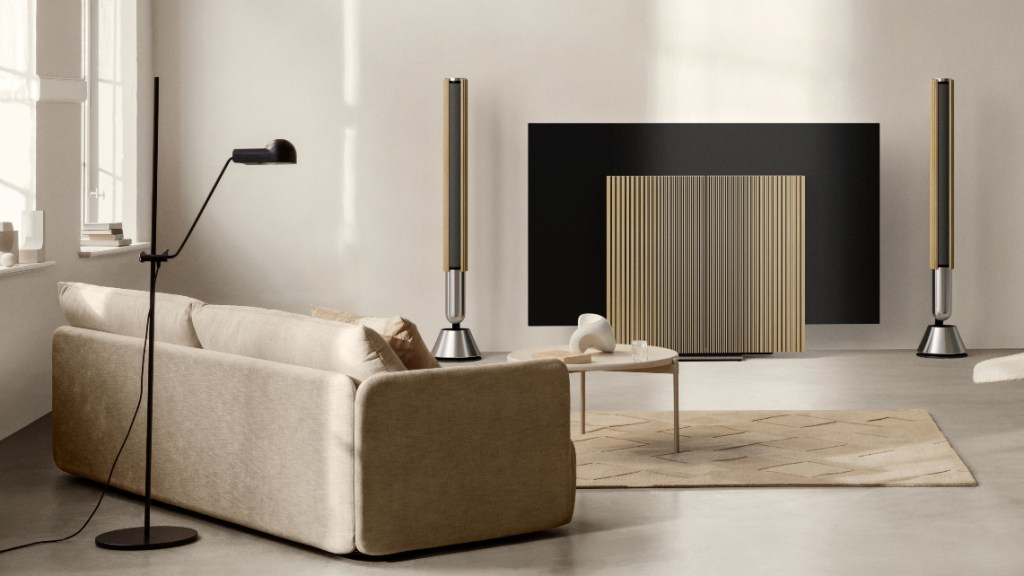 Bang & Olufsen Beolab 28 speakers aside a Beovision Harmony OLED TV in a designer living room