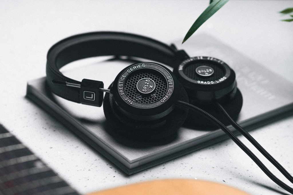 The Grado SR125x headphones on a notebook