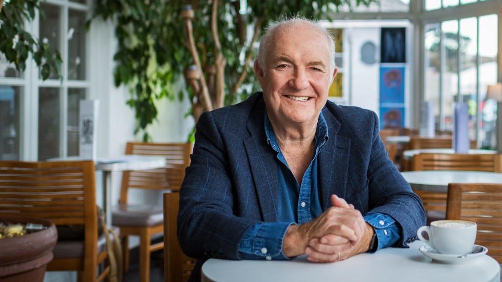 Cornish seafood chef Rick Stein sitting with a coffee