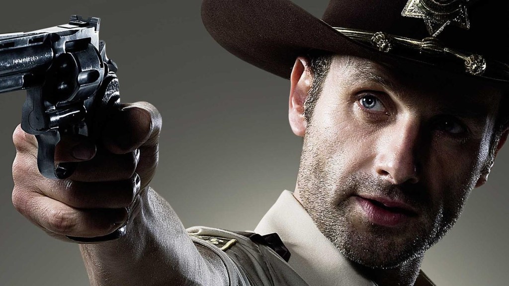 Andrew Lincoln as Rick Grimes in The Walking Dead wielding a pistol