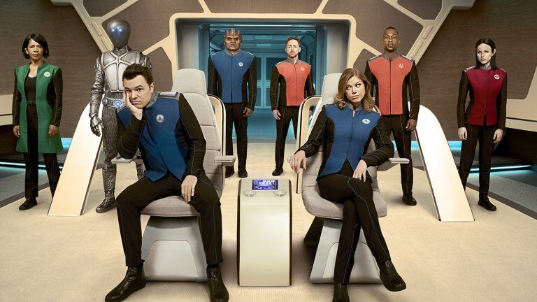 The crew of the Orville pose on the starship bridge