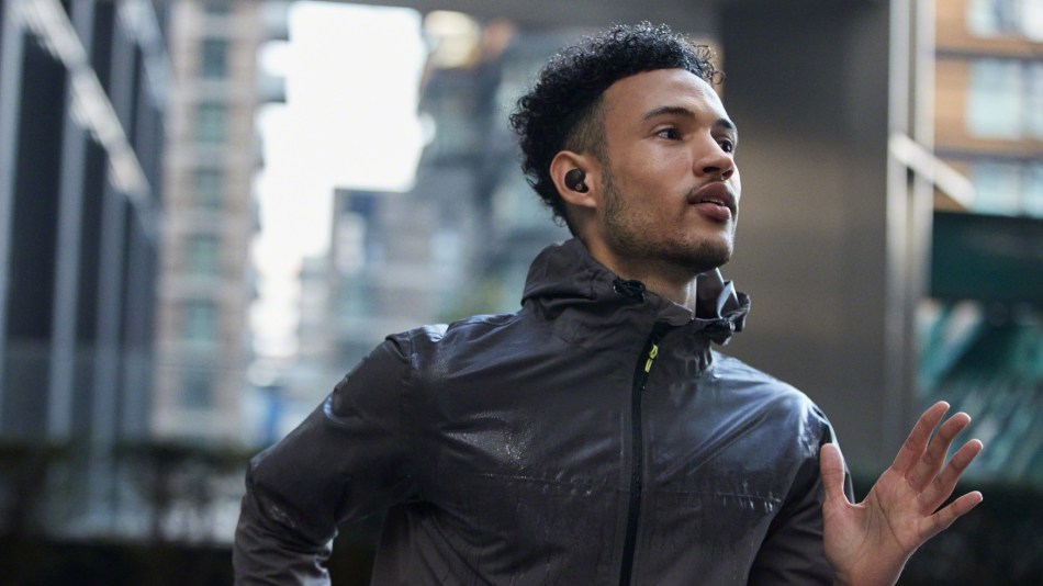 Sony WF-1000XM4 Sony headphones being worn while jogging in the rain