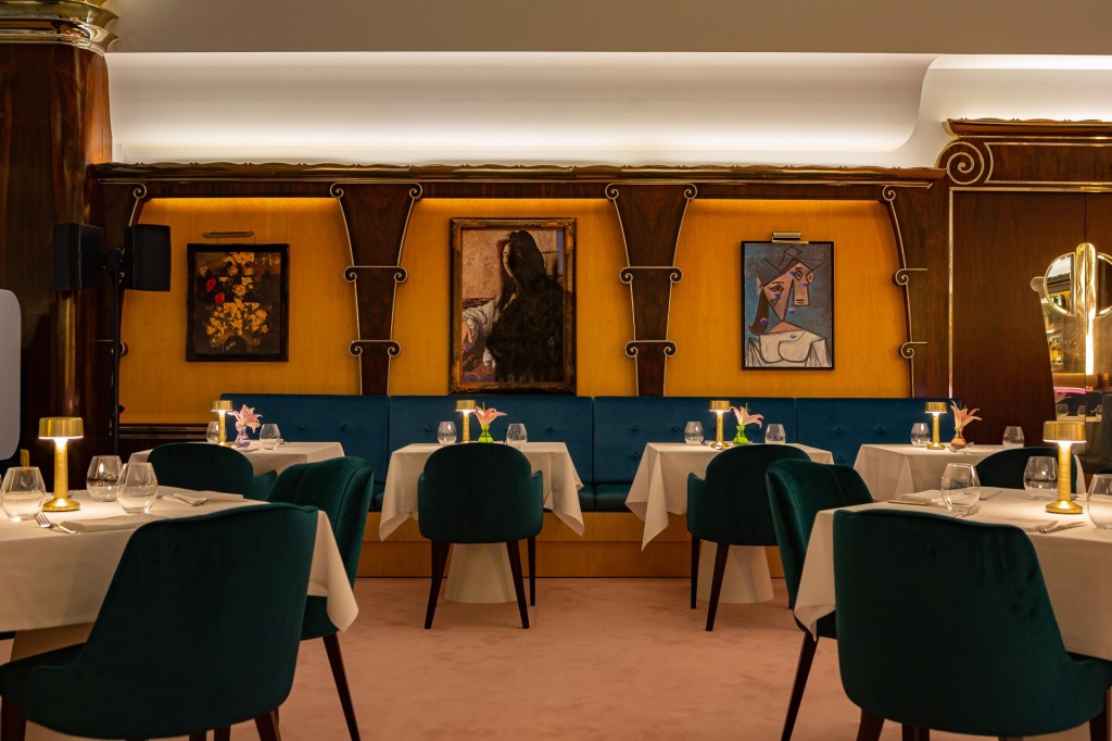 Stolen works of art hang on the walls in Selina Kyle’s Rogue’s Gallery in park Row