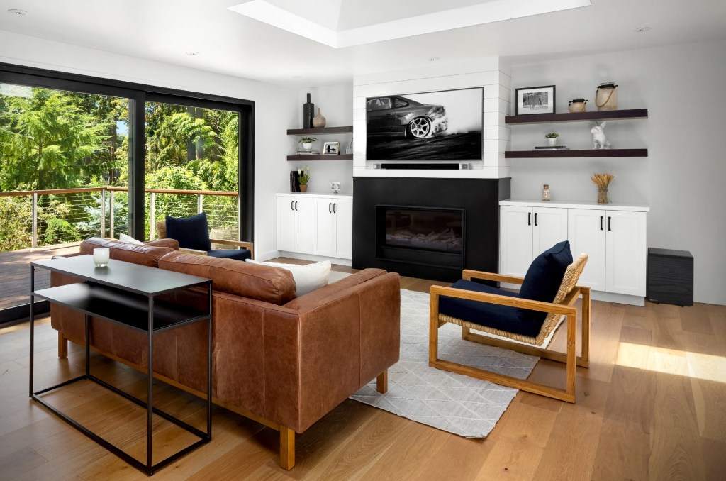 A Klipsch Cinema sound bar on the wall in a smart modern room