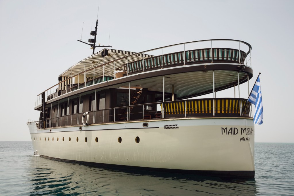 The maid Marion 2 yacht at sea with flag waving