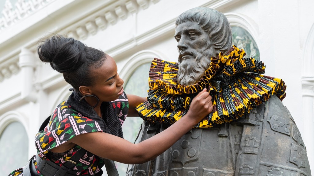 A Victorian ruff is added to the statue of an explorer in Liverpool