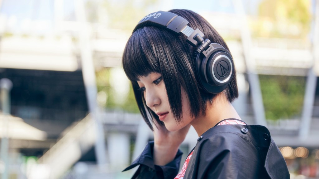 Audio Technica ATH-M50xBT2 headphones worn by an Asian lady out and about