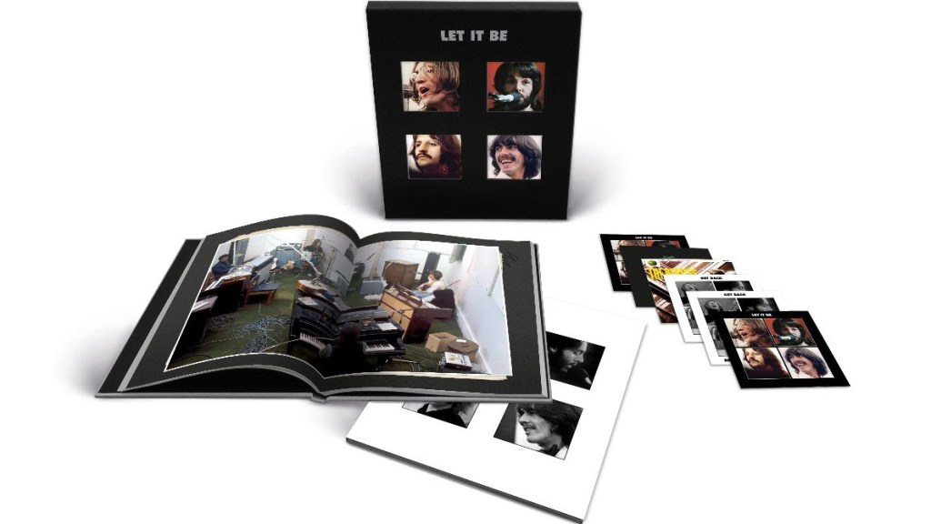 The Beatles Let it Be Super Deluxe collection pack opened up to show book and discs