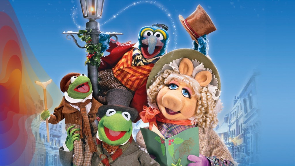 Kermit, Miss Piggy and the Muppets cast in period Christmas Carl costumes