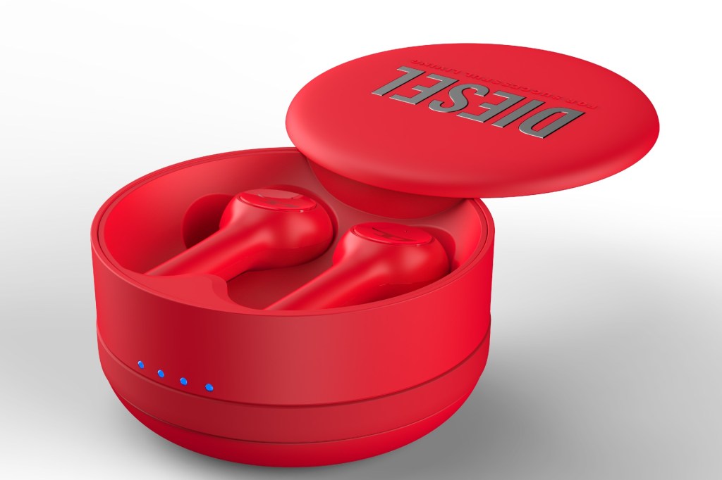 A close up of bright red Diesel earbuds in their charging case