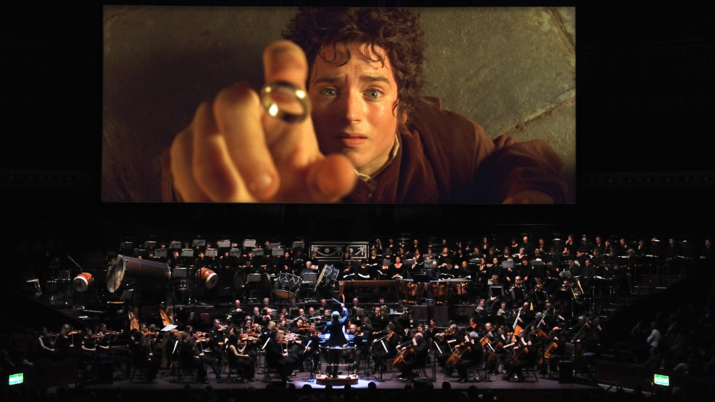 The first Lord of the Rings film plays on a giant screen above an orchestra at the Royal Albert Hall