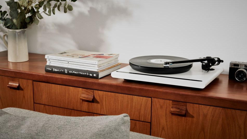 White Roksan Attessa turntable on a sleek sideboard