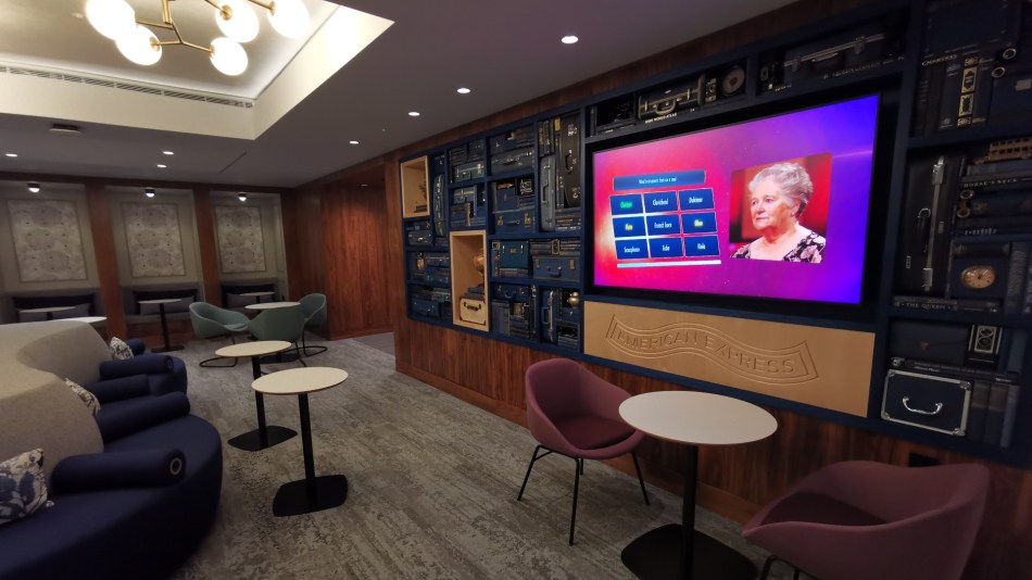 The Ammex Centurion lounge area at LHR with large TV display