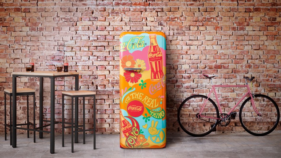 colourful Smeg Unity fridge against a brick wall