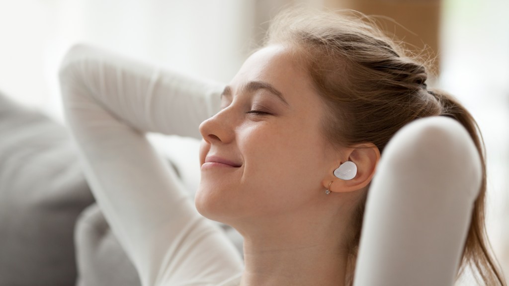 Cambridge Audio Melomania Touch earphones being worn