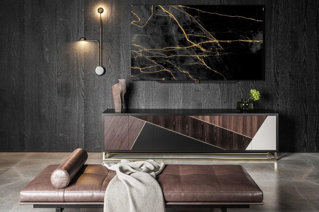 The Loewe bild s.77 OLED TV hangs on the wall