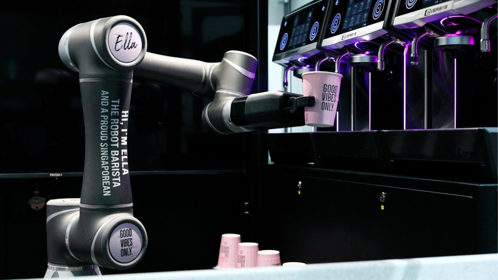 Ella the robot barista serves a cup of coffee