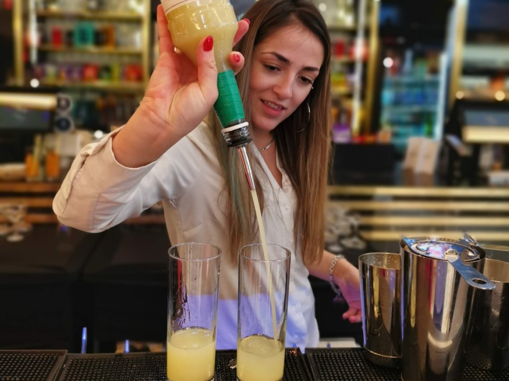 Bartender at The 355 press screening makes a cocktail