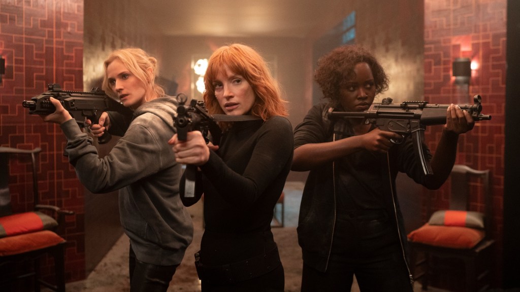 Three of The 355 brandishing weapons