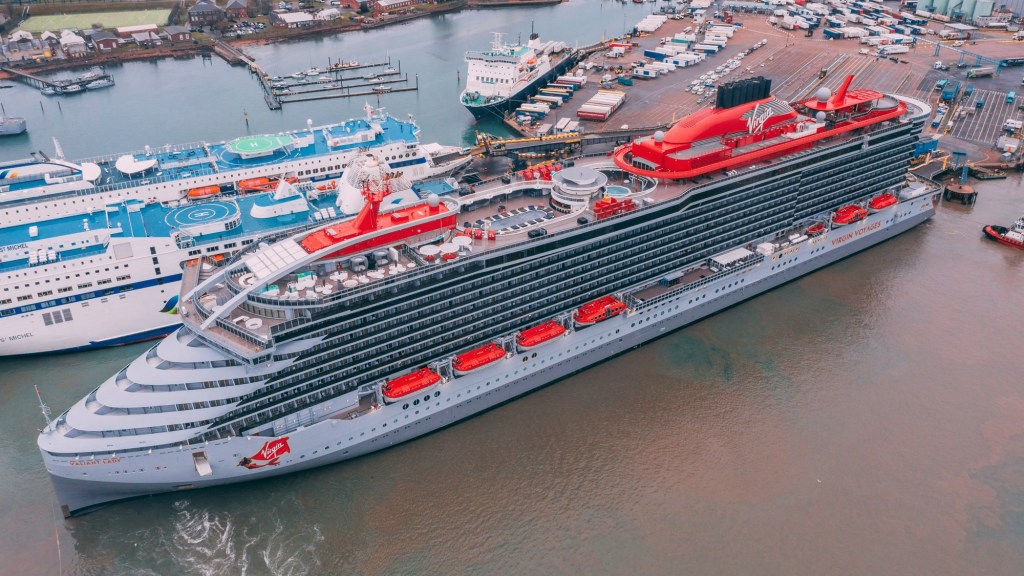 An aerial view of Virgin Voyages Valiant Lady at London Cruise Terminal