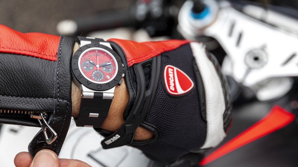 The Bugari Ducati sports watch on the arm of a biker in Ducati leathers