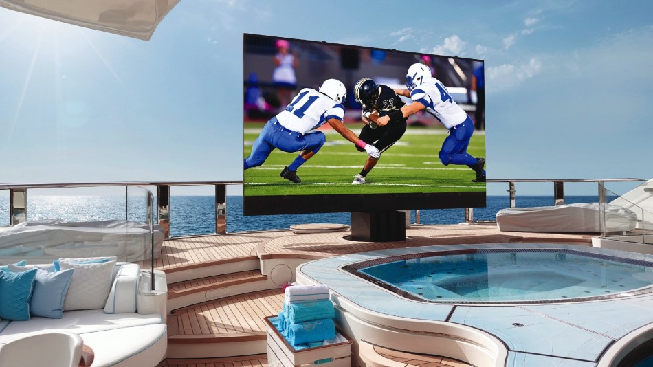Giant C SEED outdoor TV on a superyacht, displaying an American football game