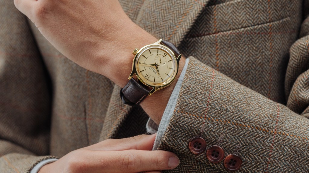 The Marloe Pacific watch worn on a besuited arm
