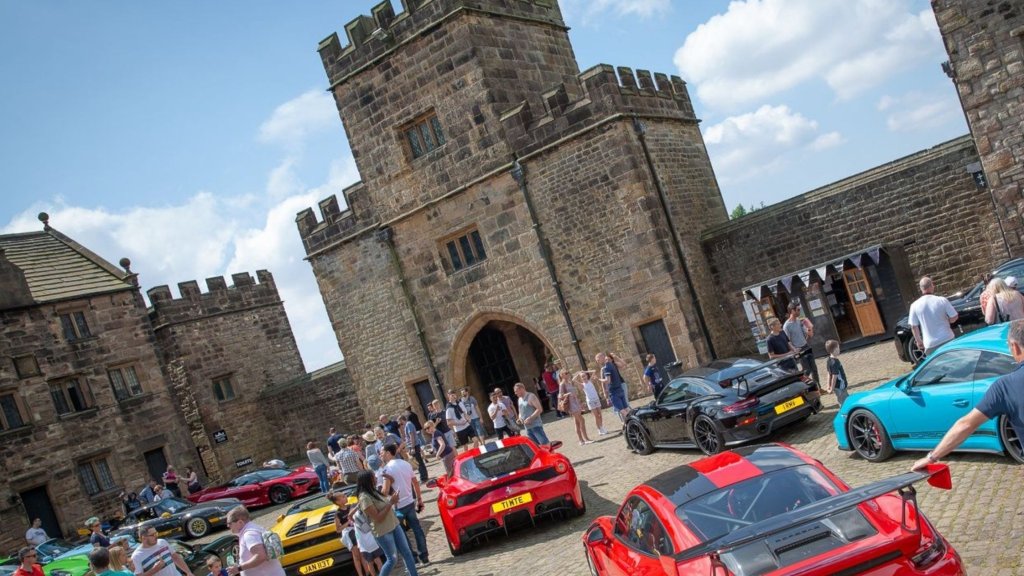 Supercars assemble outside the gates of historic Hoghton Tower