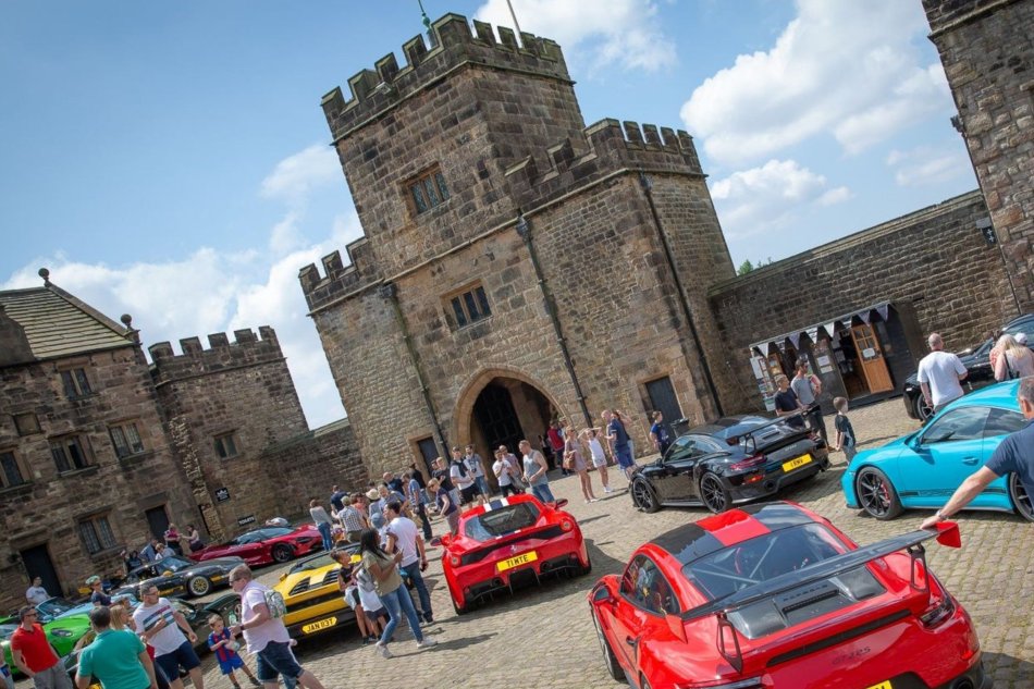 Supercars assemble outside the gates of historic Hoghton Tower
