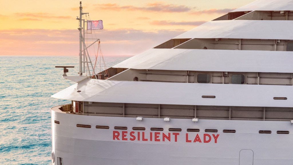 Virgin Voyages Resilient Lady at sea as the sun sets