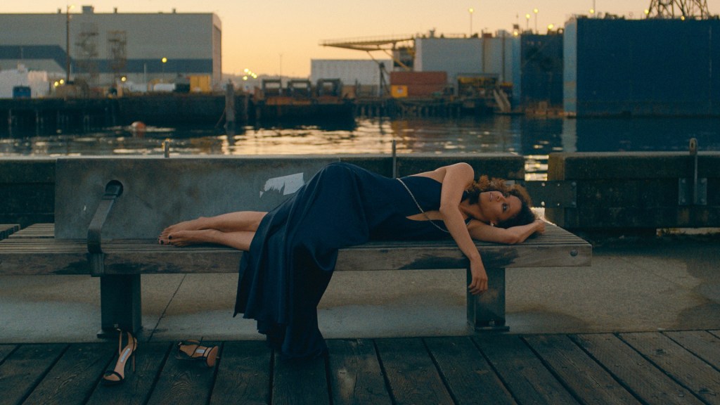 Gugu Mbatha-Raw reclines on a bench in San Francisco in a scene from Apple TV+ show Surface