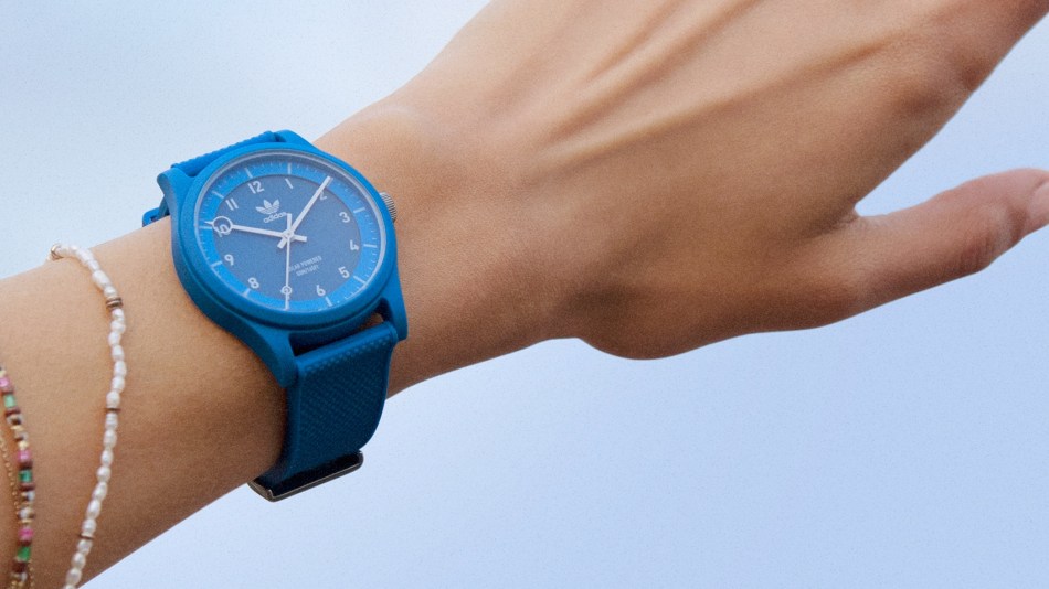 A Timex Adidas Original blue Project Two watch on a wrist