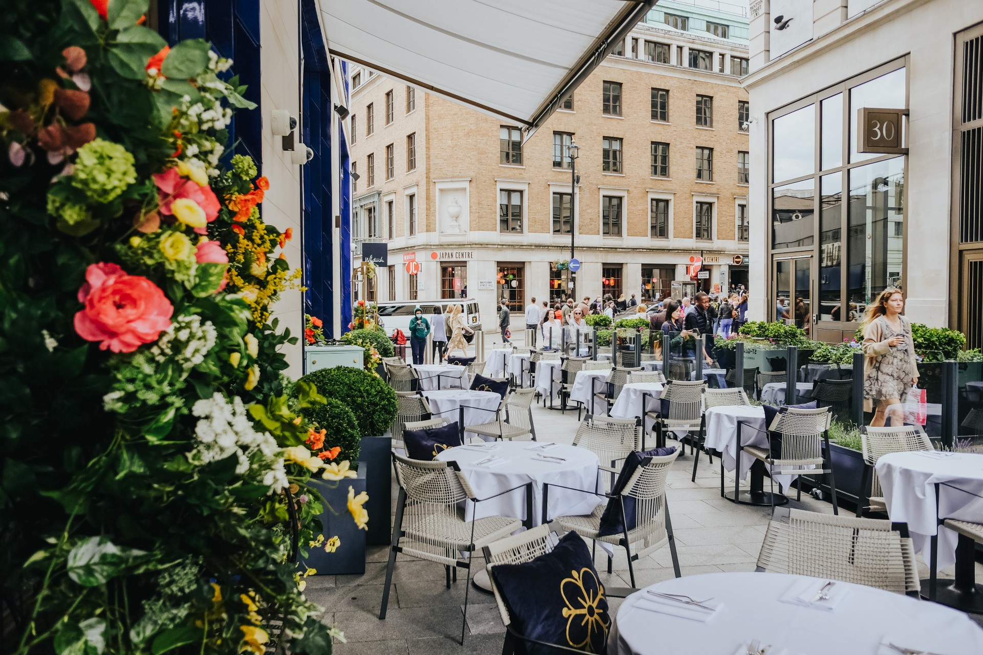 The terrace outside The Londoner awash with colourful flowers