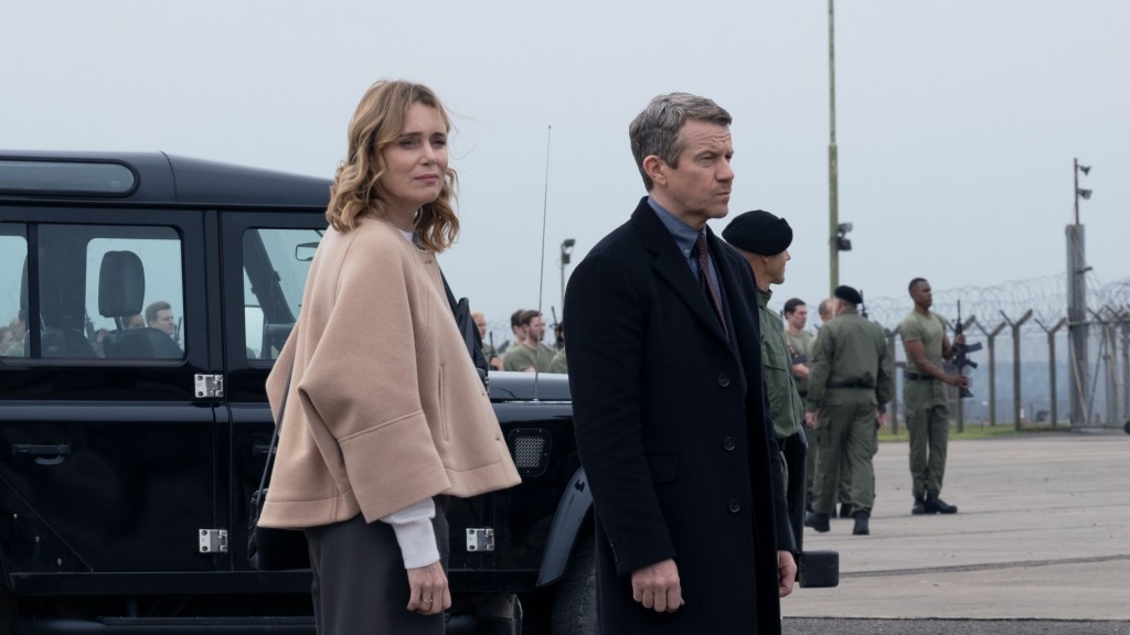 Keeley Hawes and Max Beesley surrounded by troops in The Midwich Cuckoos