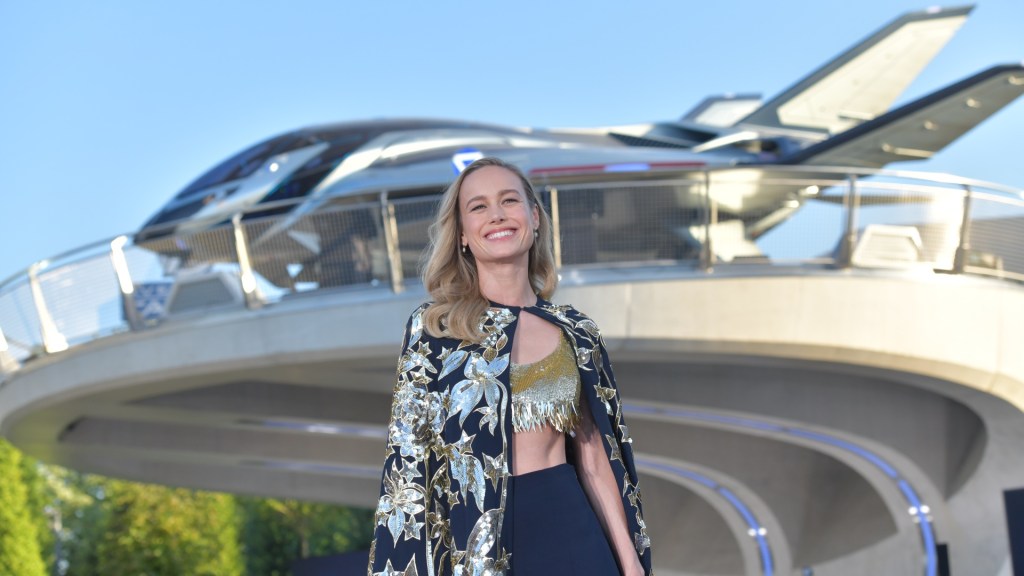 Captain marvel star Brie Larson beams (not in a super hero way) in from of the Quinjet at Avengers Campus Disneyland Paris, clearly happy she doesn't have to queue for rides