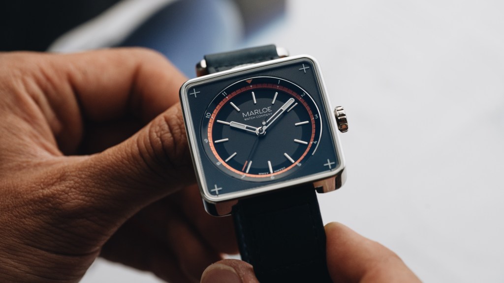 The Marloe Eagle watch held up close, offering a close look at its square dial...