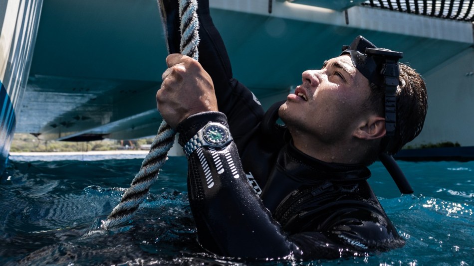 The Spinnaker Spence 300 on the wrist of a scuba diver as he hauls himself from the drink. He looks like he's about to deliver a box of Milk Tray