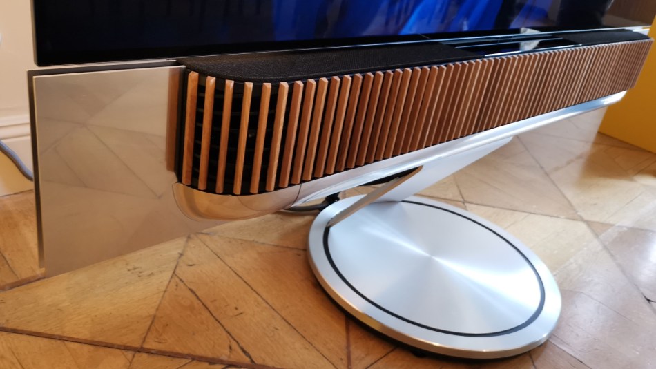 The Bang & Olufsen Beosund Theatre soundbar close-up, sitting on its circular stand