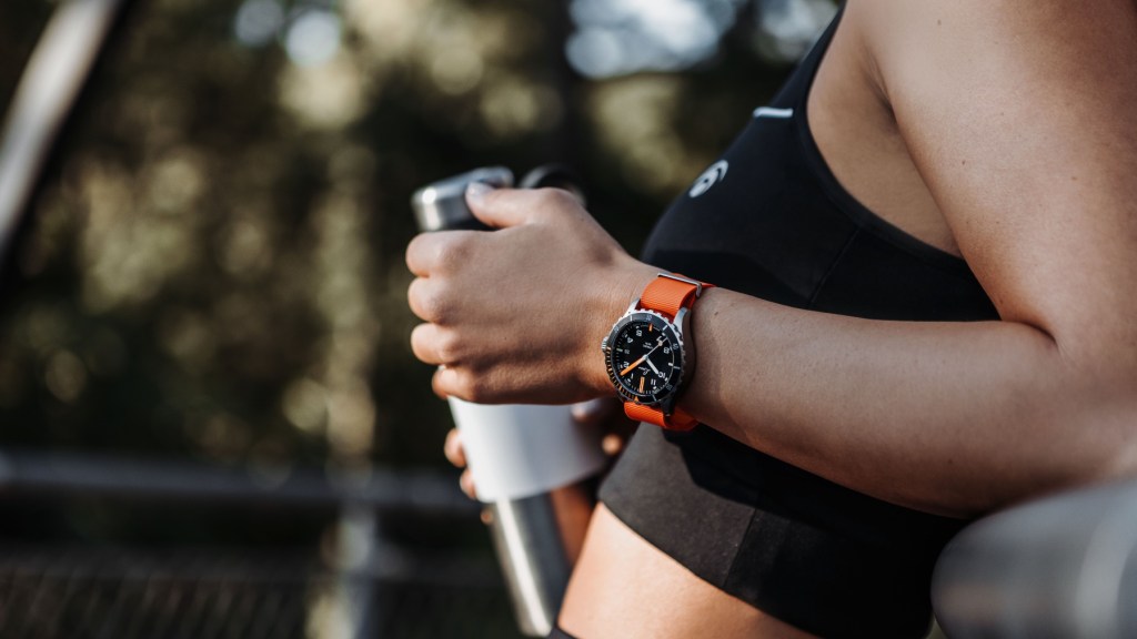 A Laco Scorpion 39mm adventure watch worn by a sportswoman