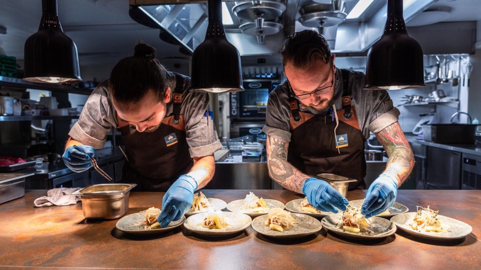 Chefs at work inside The Fangst restaurant in Norway
