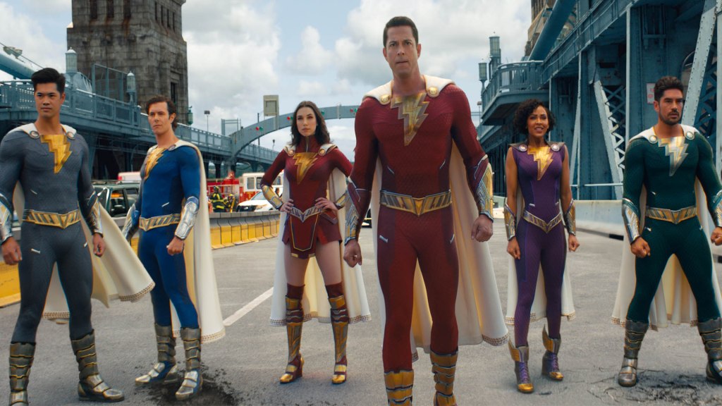 The Shazam family save the day on a collapsing bridge in Fury of the Gods