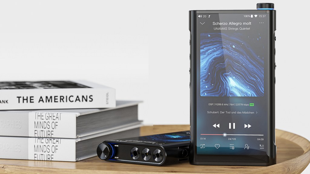 The FiiO MS15S portable music player, alongside a pile of books