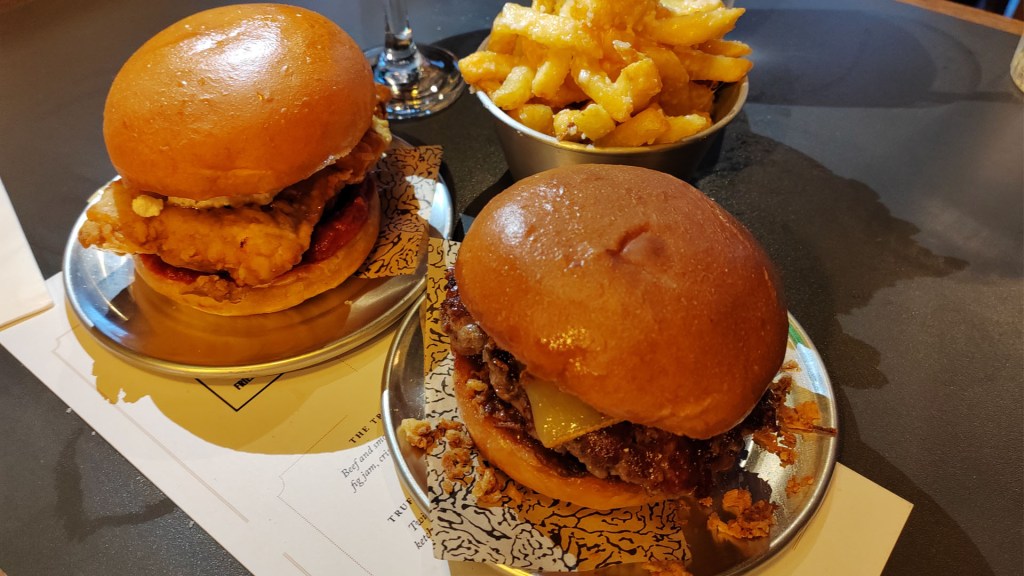 Two Truffle Burgers on a menu with chips