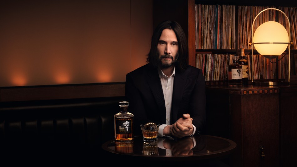 House of Suntory Partners with Keanu Reeves for 100th Anniversary. Reeves is pictured in a vinyl bar