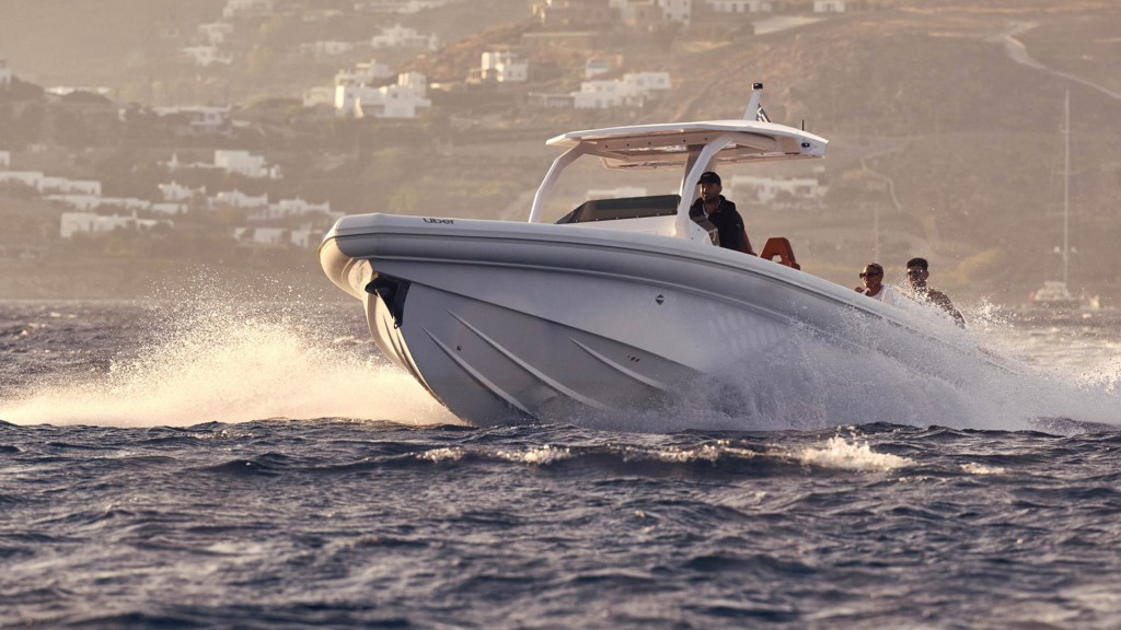 An Uber boat speeding through the waters around Mykonos
