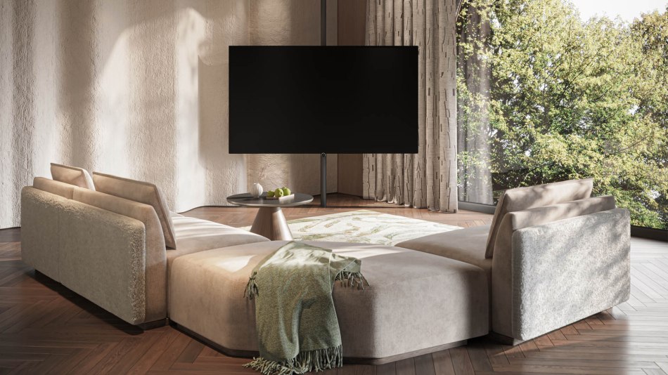 A Loewe 77-inch OLED TV in front of an L-shaped sofa