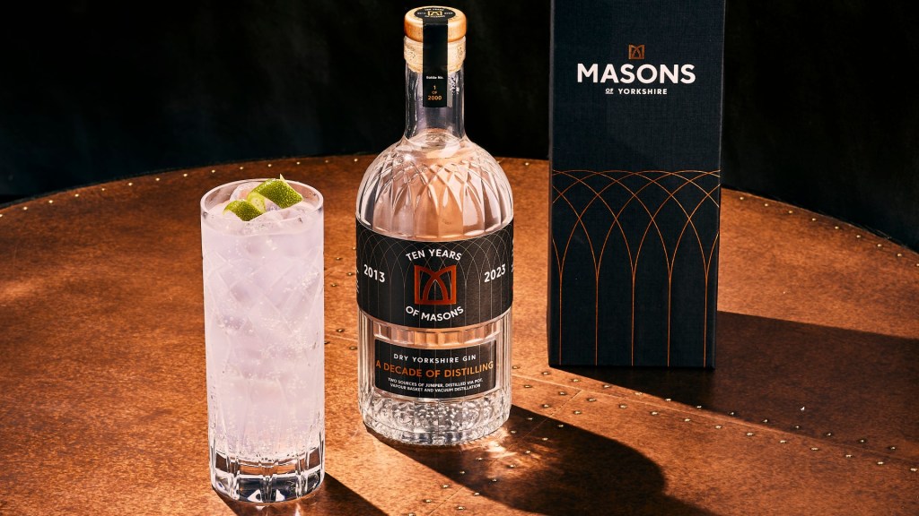 A gin cocktail alongside a bottle of Masons of Yorkshire 10th anniversay gin