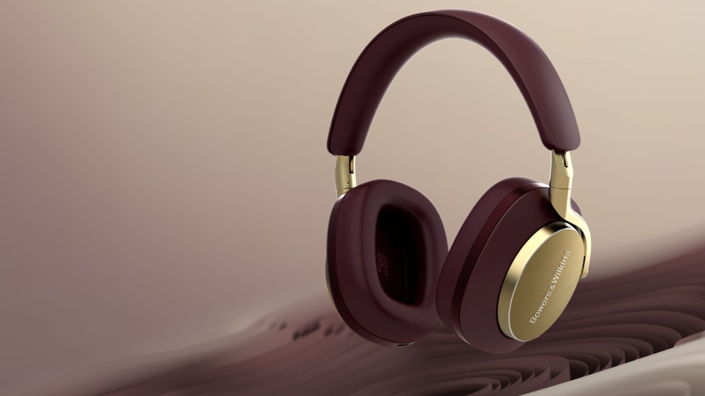 A pair of Royal Burgundy Px8 Bowers & Wilkins headphones floating in the air