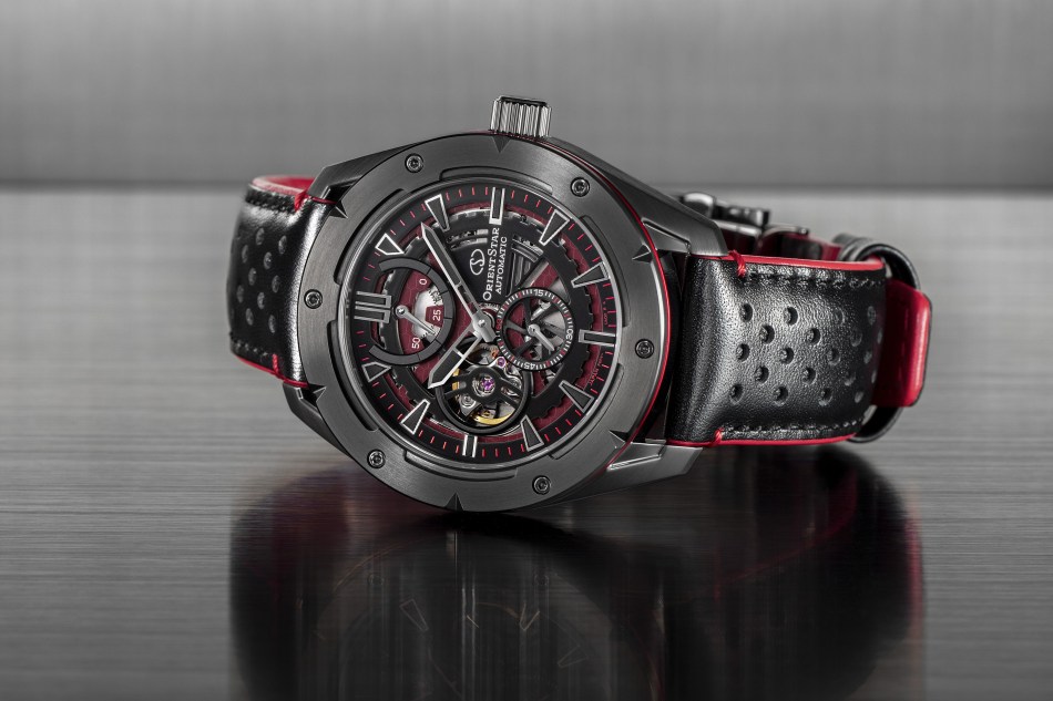 An Orient Star black dial Avant Garde Skeleton watch on a shiny surface