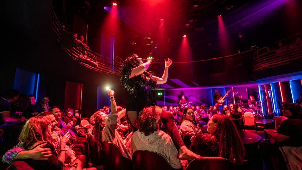 Host Bernie Dieter gets into the crowd at Bernie Dieter's Club Kabarett